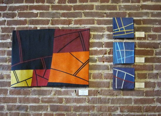 Structures #66, Structures #137, Structures #140, Structures #139 at MacSpa - artwork displayed on a brick wall